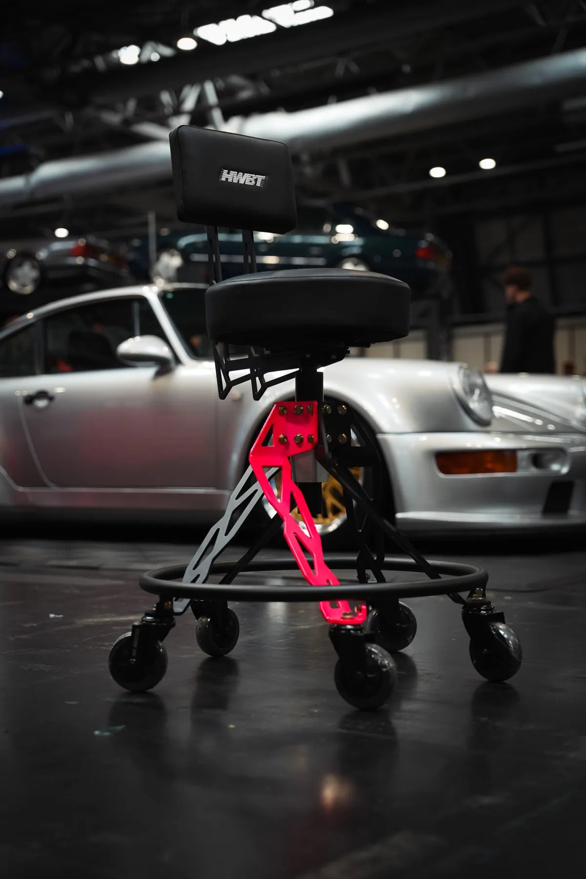 Pink HWBT Helix Hi-Rider in front of a Porsche 911